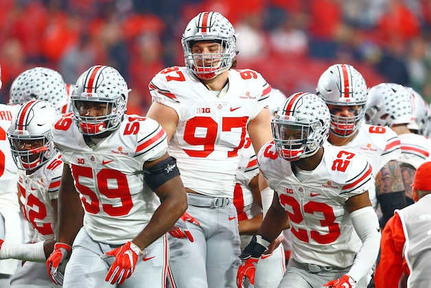 Jan 1, 2016; Glendale, AZ, USA; Ohio State Buckeyes defensive lineman Tyquan Lewis (59), defensive lineman Joey Bosa (97) and safety Tyvis Powell (23) prior to the game against the Notre Dame Fighting Irish during the 2016 Fiesta Bowl at University of Phoenix Stadium. The Buckeyes defeated the Fighting Irish 44-28. Mandatory Credit: Mark J. Rebilas-USA TODAY Sports