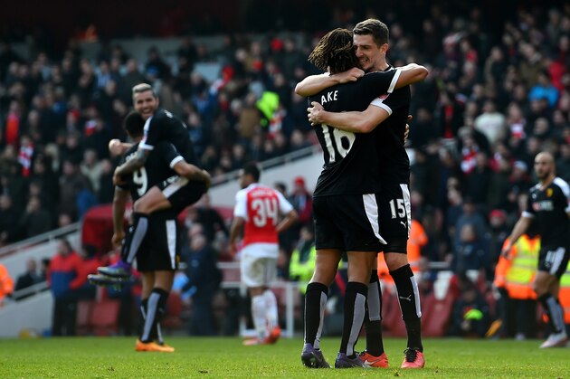 LONDON, ENGLAND - MARCH 13:  Nathan Ake (16) and Craig Cathcart of Watford (15) celebrate victory after the Emirates FA Cup sixth round match between Arsenal and Watford at Emirates Stadium on March 13, 2016 in London, England.  (Photo by Shaun Botterill/Getty Images)