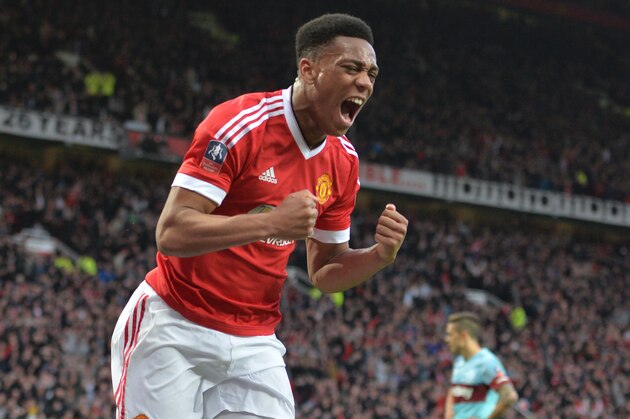 Manchester United's French striker Anthony Martial celebrates after scoring their first goal during the English FA Cup quarter final football match between Manchester United and West Ham United at Old Trafford in Manchester, north west England, on March 13, 2016.
The game finished 1-1. / AFP / PAUL ELLIS / RESTRICTED TO EDITORIAL USE. No use with unauthorized audio, video, data, fixture lists, club/league logos or 'live' services. Online in-match use limited to 75 images, no video emulation. No use in betting, games or single club/league/player publications.  /         (Photo credit should read PAUL ELLIS/AFP/Getty Images)