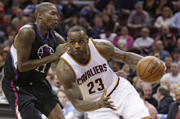 Cleveland Cavaliers' LeBron James (23) drives past Los Angeles Clippers' Jamal Crawford (11) in the second half of an NBA basketball game Thursday, Jan. 21, 2016, in Cleveland. (AP Photo/Tony Dejak)