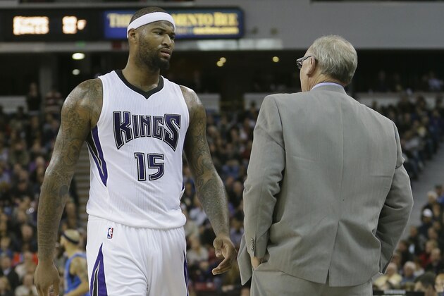 Sacramento Kings forward DeMarcus Cousins passes Kings head coach George Karl, as he walks to the bench during the second half of an NBA basketball game against the Dallas Mavericks in Sacramento, Calif., Monday, Nov. 30, 2015. The Kings won 112-98.(AP Photo/Rich Pedroncelli)