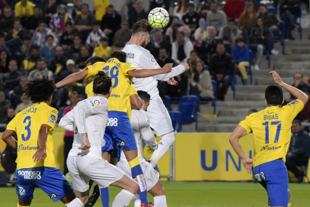 Real Madrid's Sergio Ramos, top, jumps to head the ball during a Spanish La liga soccer match at the Gran Canaria stadium in Las Palmas, Spain, Sunday March 13, 2016. (AP Photo/Gerado Ojeda)