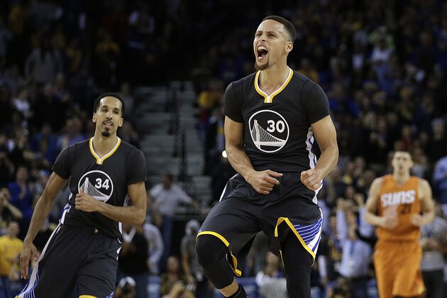 Golden State Warriors' Stephen Curry celebrates a score against the Phoenix Suns in the final seconds of the NBA basketball game Saturday, March 12, 2016, in Oakland, Calif. (AP Photo/Ben Margot)