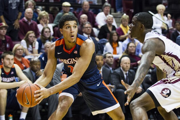 Virginia forward Isaiah Wilkins tries to pass against Florida State guard Dwayne Bacon, Jr. in the second half of an NCAA college basketball game in Tallahassee, Fla., Sunday, Jan. 17, 2016. Florida State defeated Virginia 69-62. (AP Photo/Mark Wallheiser)