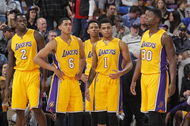 SACRAMENTO, CA - JANUARY 7: Brandon Bass #2, Jordan Clarkson #6, D'Angelo Russell #1 and Julius Randle #30 of the Los Angeles Lakers look on during the game against the Sacramento Kings on January 7, 2016 at Sleep Train Arena in Sacramento, California. NOTE TO USER: User expressly acknowledges and agrees that, by downloading and or using this photograph, User is consenting to the terms and conditions of the Getty Images Agreement. Mandatory Copyright Notice: Copyright 2016 NBAE (Photo by Rocky Widner/NBAE via Getty Images)