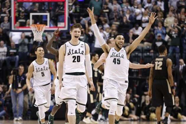 Michigan State players celebrate after an NCAA college basketball game against Purdue in the finals at the Big Ten Conference tournament, Sunday, March 13, 2016, in Indianapolis. Michigan State won 66-62. (AP Photo/AJ Mast)
