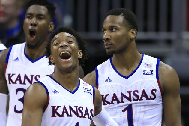 Kansas guard Devonte' Graham (4) and forward Jamari Traylor, back, celebrate a dunk by Wayne Selden Jr. (1) during the second half of an NCAA college basketball game against Baylor in the semifinals of the Big 12 conference tournament in Kansas City, Mo., Friday, March 11, 2016. Kansas defeated Baylor 70-66. (AP Photo/Orlin Wagner)
