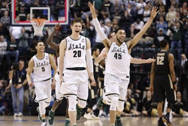 Michigan State players celebrate after an NCAA college basketball game against Purdue in the finals at the Big Ten Conference tournament, Sunday, March 13, 2016, in Indianapolis. Michigan State won 66-62. (AP Photo/AJ Mast)