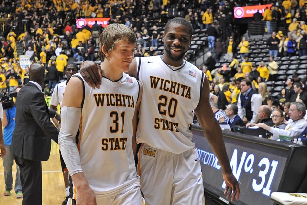 WICHITA, KS - JANUARY 18:  Players Ron Baker #31 and Kadeem Coleby #20 of the Wichita State Shockers walk off the court together after beating the Indiana State Sycamores on January 18, 2014 at Charles Koch Arena in Wichita, Kansas.  Wichita State defeated Indiana State 68-48. (Photo by Peter Aiken/Getty Images)