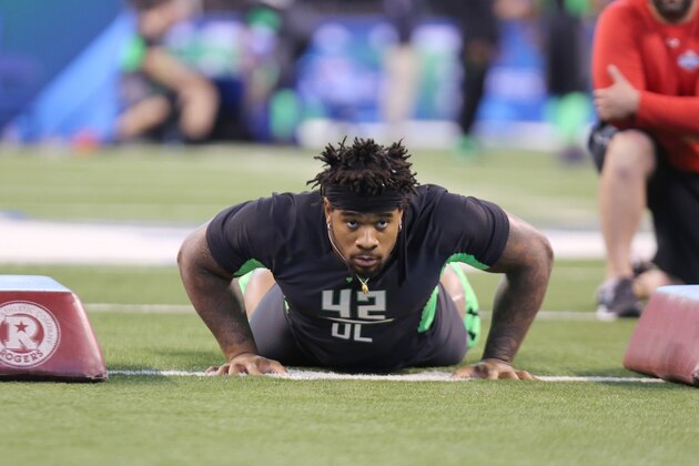 Mississippi defensive lineman Robert Nkemdiche performs a drill at the NFL football scouting combine Sunday, Feb. 28, 2016, in Indianapolis. (AP Photo/Gregory Payan)