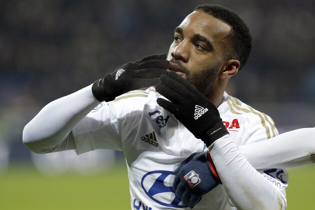 Lyon's Alexandre Lacazette celebrates after scoring a goal  during the French League One soccer match between Lyon and Guingamp in Decines, near Lyon, central France, Sunday, March 6, 2016. (AP Photo/Laurent Cipriani)