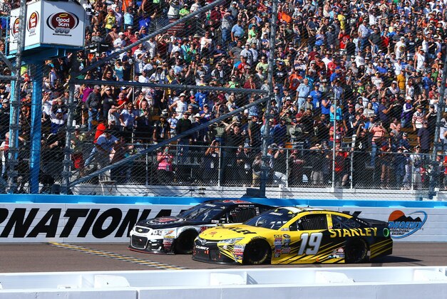 Mar 13, 2016; Avondale, AZ, USA; NASCAR Sprint Cup Series driver Kevin Harvick (4) beats Carl Edwards (19) to the finish line to win the Good Sam 500 at Phoenix International Raceway. Mandatory Credit: Mark J. Rebilas-USA TODAY Sports
