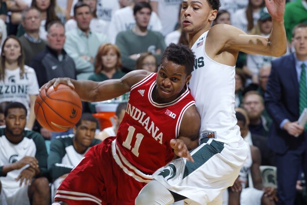 Indiana's Kevin Yogi Ferrell (11) drives against Michigan State's Bryn Forbes during the first half of an NCAA college basketball game, Sunday, Feb. 14, 2016, in East Lansing, Mich. (AP Photo/Al Goldis)