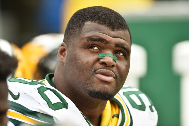 CHARLOTTE, NC - NOVEMBER 8:  B.J. Raji #90 of the Green Bay Packers looks on during a NFL game against the Carolina Panthers at Bank Of America Stadium on November 8, 2015 in Charlotte, North Carolina.  (Photo by Ronald C. Modra/Sports Imagery/Getty Images)