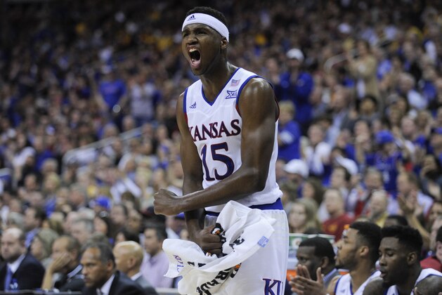 KANSAS CITY, MO - MARCH 12:  Carlton Bragg Jr. #15 of the Kansas Jayhawks cheers for his teammates during a game against the West Virginia Mountaineers in the second half during the championship game of the Big 12 Basketball Tournament at Sprint Center on March 12, 2016 in Kansas City, Missouri. (Photo by Ed Zurga/Getty Images)