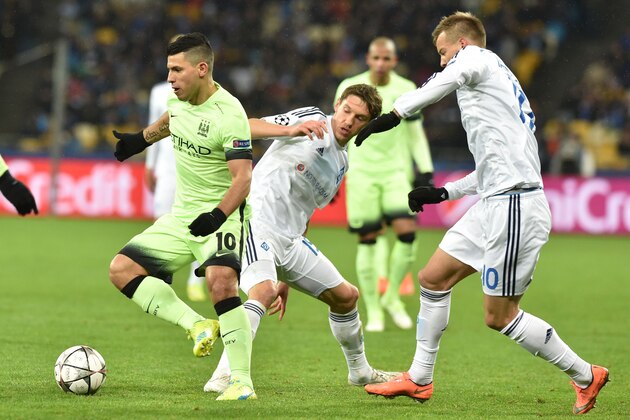 Manchester City's Argentinian forward Sergio Aguero (L) vies with Dynamo Kiev's Ukrainian midfielder Denys Garmash (C) and Dynamo Kiev's Ukrainian forward Andriy Yarmolenko during the UEFA Champions league round of 16, first leg, football match FC Dynamo Kyiv vs Manchester City  FC at the NSC Olimpiski stadium in Kiev on February 24, 2016.  AFP PHOTO / GENYA SAVILOV / AFP / GENYA SAVILOV        (Photo credit should read GENYA SAVILOV/AFP/Getty Images)