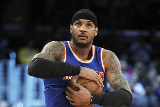 New York Knicks forward Carmelo Anthony grabs the basketball prior to an NBA basketball game against the Los Angeles Lakers in Los Angeles, Sunday, March 13, 2016. (AP Photo/Alex Gallardo)