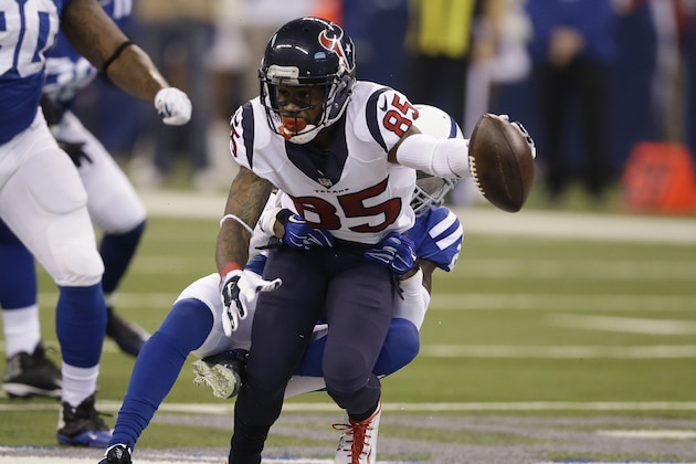 Houston Texans' Nate Washington (85) is tackled by Indianapolis Colts' Darius Butler (20) during the first half of an NFL football game Sunday, Dec. 20, 2015, in Indianapolis. (AP Photo/Darron Cummings)