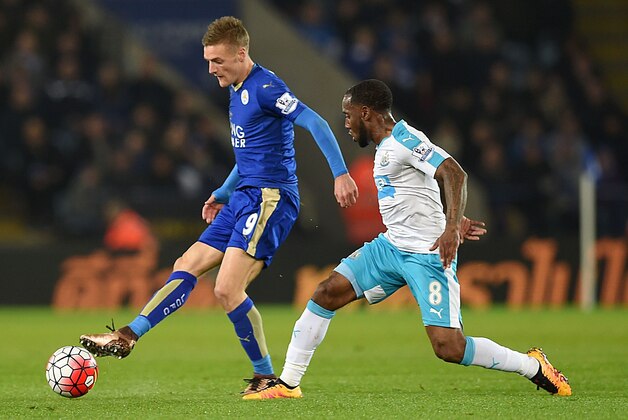 Leicester City's English footballer Jamie Vardy (L) is challenged by Newcastle's Dutch midfielder Vurnon Anita during the English Premier League football match between Leicester City and Newcastle at King Power Stadium in Leicester, central England on March 14, 2016. / AFP / PAUL ELLIS / RESTRICTED TO EDITORIAL USE. No use with unauthorized audio, video, data, fixture lists, club/league logos or 'live' services. Online in-match use limited to 75 images, no video emulation. No use in betting, games or single club/league/player publications.  /         (Photo credit should read PAUL ELLIS/AFP/Getty Images)
