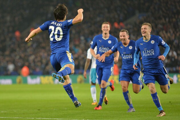 Leicester City's Japanese footballer Shinji Okazaki (L) celebrates after scoring his team's first goal during the English Premier League football match between Leicester City and Newcastle at King Power Stadium in Leicester, central England on March 14, 2016. / AFP / PAUL ELLIS / RESTRICTED TO EDITORIAL USE. No use with unauthorized audio, video, data, fixture lists, club/league logos or 'live' services. Online in-match use limited to 75 images, no video emulation. No use in betting, games or single club/league/player publications.  /         (Photo credit should read PAUL ELLIS/AFP/Getty Images)