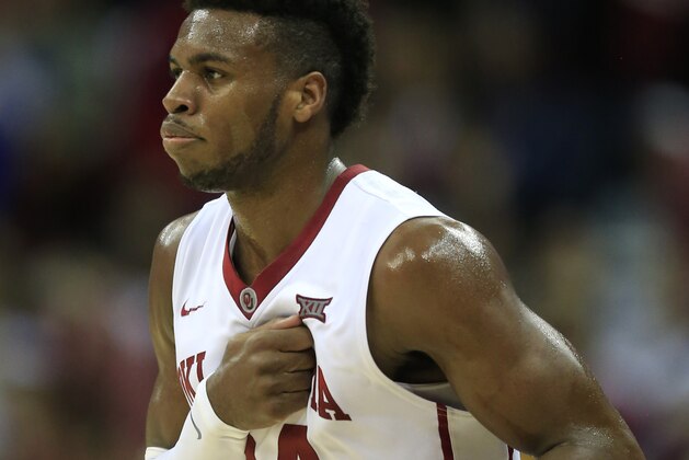 Oklahoma guard Buddy Hield pounds his chest after a 3-point basket during the first half of an NCAA college basketball game against Iowa State in the quarterfinals of the Big 12 Conference men's tournament in Kansas City, Mo., Thursday, March 10, 2016. (AP Photo/Orlin Wagner)