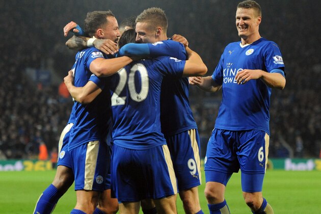 Leicester’s players celebrate after Shinji Okazaki, obscured, scored during the English Premier League soccer match between Leicester City and Newcastle United at the King Power Stadium in Leicester, England, Monday, March 14, 2016. (AP Photo/Rui Vieira)