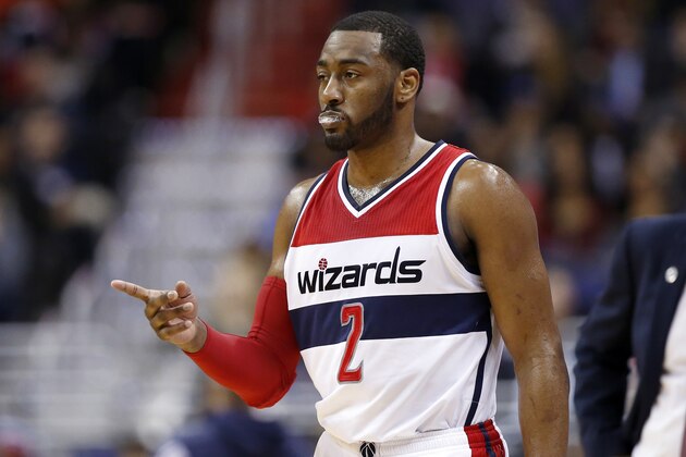 Washington Wizards guard John Wall (2) comes back in the game after a break during the first half of an NBA basketball game against the Detroit Pistons, Monday, March 14, 2016, in Washington. (AP Photo/Alex Brandon)