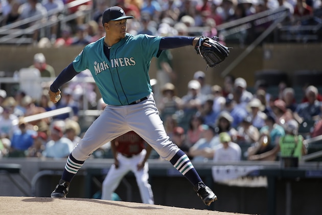 Seattle Mariners starting pitcher Taijuan Walker throws against the Arizona Diamondbacks during the first inning of a spring training baseball game in Scottsdale, Ariz., Monday, March 14, 2016. (AP Photo/Jeff Chiu)