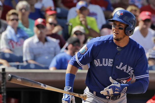 Toronto Blue Jays' Troy Tulowitzki flips his bat after drawing a walk against the Philadelphia Phillies during a spring training baseball game Saturday, March 12, 2016, in Clearwater, Fla. (AP Photo/Chris O'Meara)