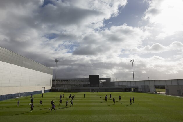 Manchester City players trains at the team's football academy by the Etihad Stadium in Manchester, England, Monday, Feb. 23, 2015. Manchester City will play Barcelona on Tuesday in a Champions League Round of 16 soccer match. (AP Photo/Jon Super)
