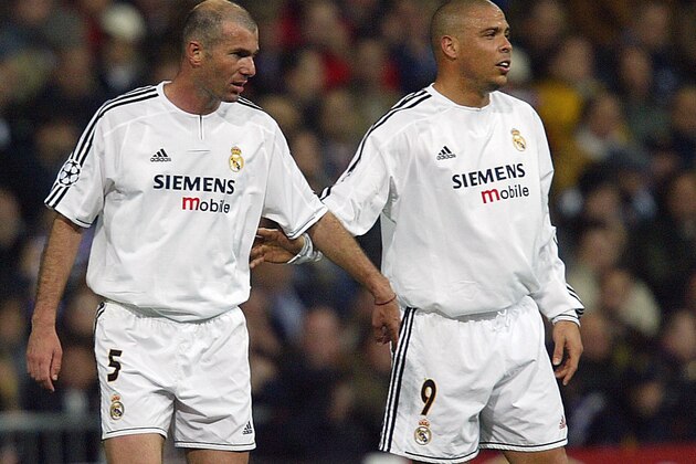 MADRID, Spain:  Real Madrid's French midfielder Zinedine Zidane and his teammate Ronaldo congratulate each other after a goal during their Champions League quarter-final first leg football match against Monaco, 24 March 2004 at the Santiago Bernabeu stadium in Madrid.   AFP PHOTO CHRISTOPHE SIMON  (Photo credit should read CHRISTOPHE SIMON/AFP/Getty Images)