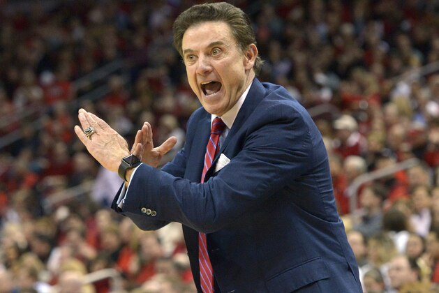 Louisville head coach Rick Pitino sends a play in to his team during the first half of an NCAA college basketball game against Syracuse, Wednesday, Feb. 17, 2016, in Louisville Ky. Louisville won 72-58. (AP Photo/Timothy D. Easley)