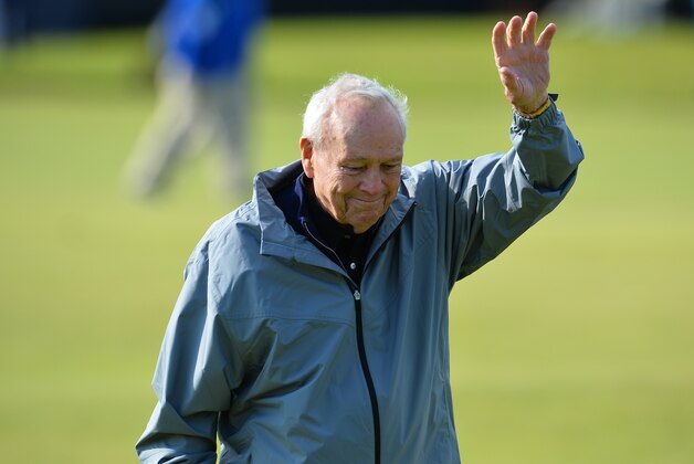 Winner of The Open in 1961 and 1962, US golfer Arnold Palmer waves to fans during the Champion Golfers' Challenge on The Old Course at St Andrews in Scotland, on July 15, 2015, ahead of The 2015 Open Golf Championship which runs July 16-19. 28 Seven groups of four Champion golfers with a combined 46 victories in golfs oldest Championship, compete in a four hole challenge, the winnings going to the charity of the winning team's choice. AFP PHOTO / GLYN KIRK        (Photo credit should read GLYN KIRK/AFP/Getty Images)