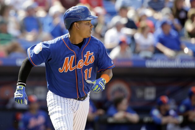 New York Mets' Ruben Tejada watches his two-run home run during the fifth inning of an exhibition spring training baseball game against the St. Louis Cardinals Thursday, March 10, 2016, in Port St. Lucie, Fla. (AP Photo/Jeff Roberson)