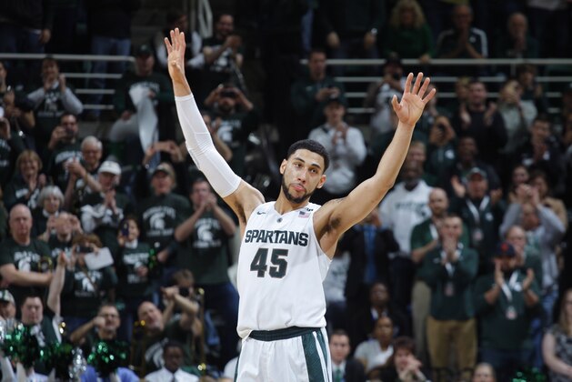 Michigan State's Denzel Valentine acknowledges the crowd as he comes out of the game in the closing minute of an NCAA college basketball game against Ohio State, Saturday, March 5, 2016, in East Lansing, Mich. Michigan State won 91-76. (AP Photo/Al Goldis)