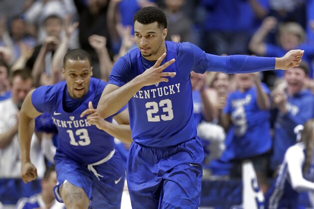 Kentucky's Jamal Murray (23) and Isaiah Briscoe (13) celebrate Murray's three point basket against Texas A&M during the second half of an NCAA college basketball game in the championship of the Southeastern Conference tournament in Nashville, Tenn., Sunday, March 13, 2016. (AP Photo/Mark Humphrey)
