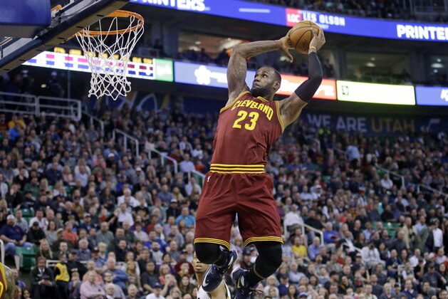 Cleveland Cavaliers forward LeBron James (23) dunks the ball against the Utah Jazz during the first quarter of an NBA basketball game Monday, March 14, 2016, in Salt Lake City. (AP Photo/Rick Bowmer)
