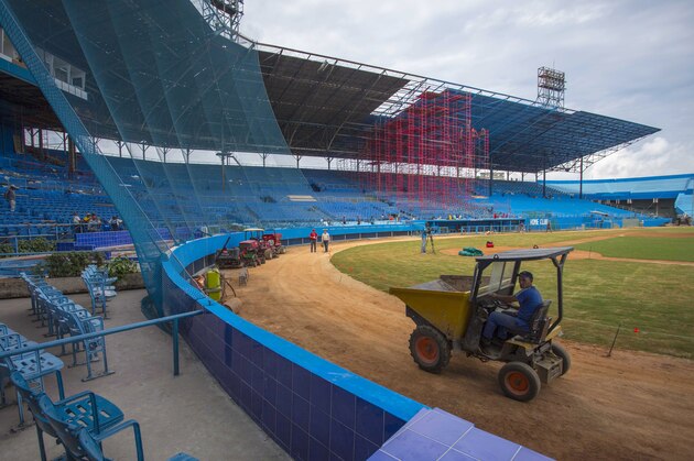 Workers work on the Latinoamericano Stadium baseball arena in Havana, Cuba, Friday, March 4, 2016. U.S. President Barack Obama plans to attend the Tampa Bay Rays' exhibition game at the arena in Cuba on March 22 during his visit. (AP Photo/Desmond Boylan)