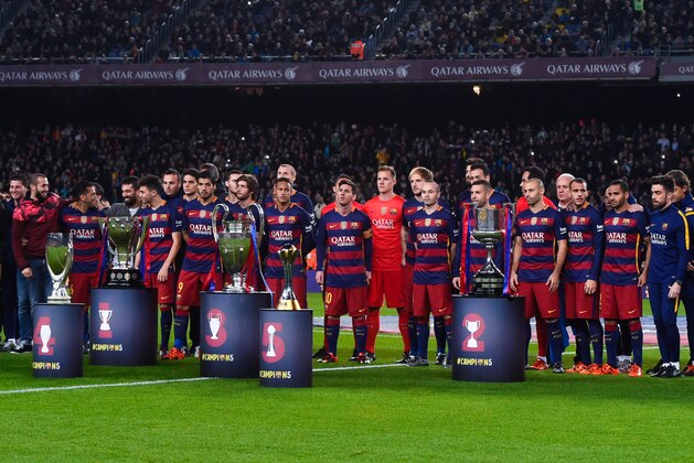 BARCELONA, SPAIN - DECEMBER 30:  FC Barcelona players pose with La Liga, UEFA Champions League, Copa del Rey, UEFA Supercup and FIFA Club World Cup trophies prior to the La Liga match between FC Barcelona and Real Betis Balompie at Camp Nou on December 30, 2015 in Barcelona, Spain.  (Photo by David Ramos/Getty Images)