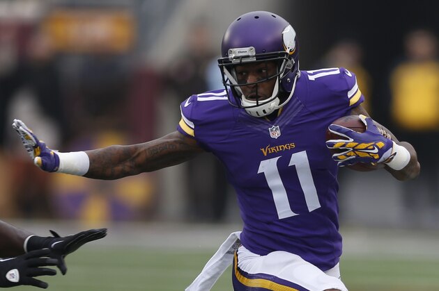 Minnesota Vikings wide receiver Mike Wallace (11) is pushed out of bounds by Seattle Seahawks strong safety Kam Chancellor (31) in the first half of an NFL football game Sunday, Dec. 6, 2015 in Minneapolis. (AP Photo/Jim Mone)