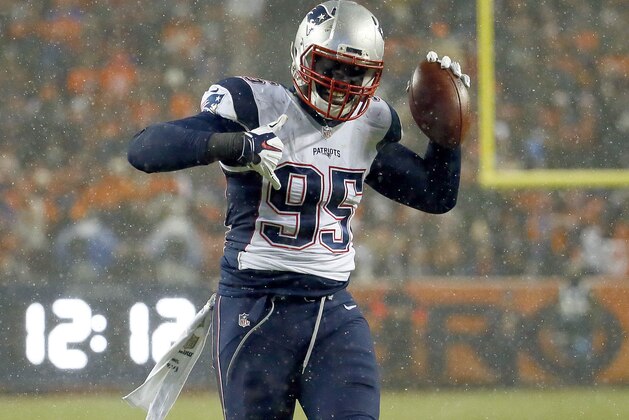 New England Patriots defensive end Chandler Jones (95) celebrates his interception against the Denver Broncos during the first half of an NFL football game, Sunday, Nov. 29, 2015, in Denver. (AP Photo/Jack Dempsey)