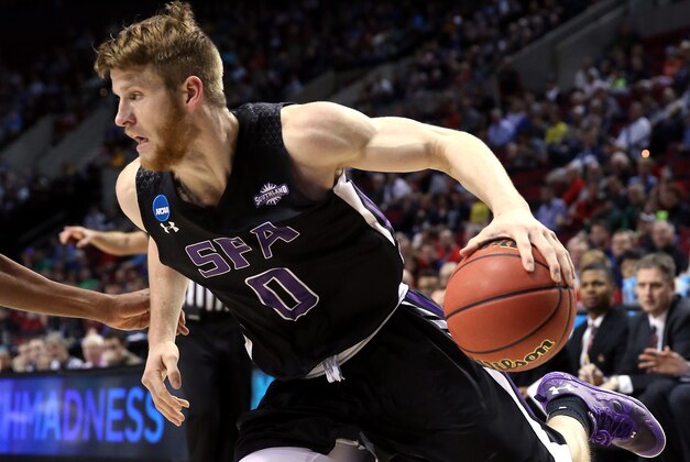PORTLAND, OR - MARCH 19: Thomas Walkup #0 of the Stephen F. Austin Lumberjacks handles the ball in the first half against the Utah Utes during the second round of the 2015 NCAA Men's Basketball Tournament at Moda Center on March 19, 2015 in Portland, Oregon.  (Photo by Stephen Dunn/Getty Images)