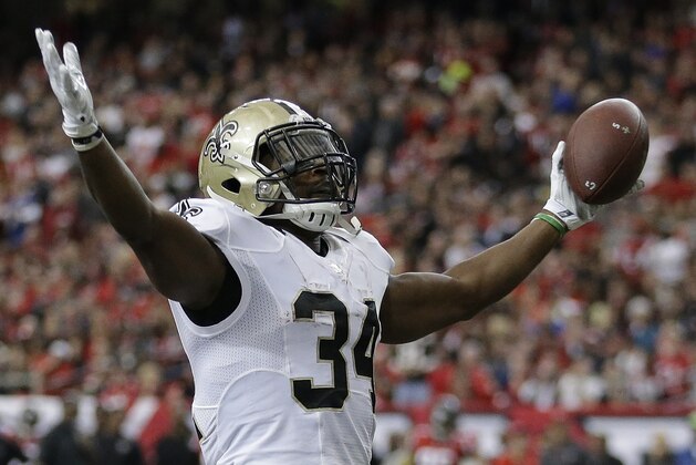 New Orleans Saints running back Tim Hightower (34) celebrates his touchdown against the Atlanta Falcons during the first half of an NFL football game, Sunday, Jan. 3, 2016, in Atlanta. (AP Photo/David Goldman)
