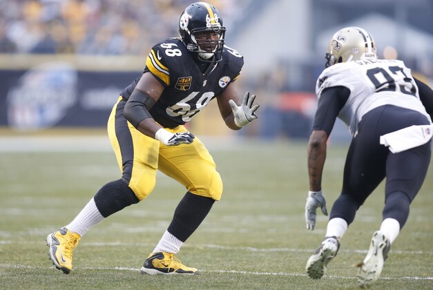 Nov 30, 2014; Pittsburgh, PA, USA; Pittsburgh Steelers tackle Kelvin Beachum (68) blocks at the line of scrimmage against New Orleans Saints outside linebacker Junior Galette (93) during the third quarter at Heinz Field. The Saints won 35-32. Mandatory Credit: Charles LeClaire-USA TODAY Sports