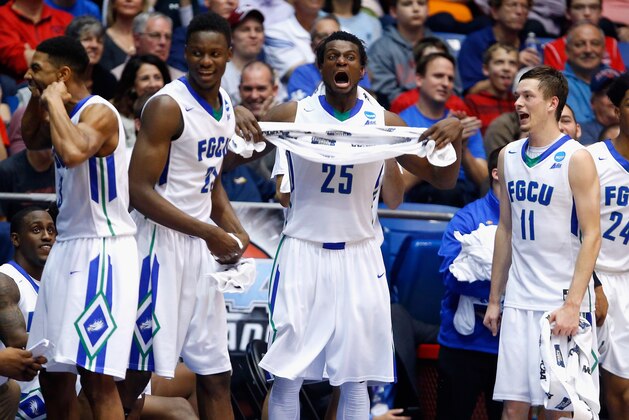 DAYTON, OH - MARCH 15:  (L-R) Julian DeBose #3 of the Florida Gulf Coast Eagles, Demetris Morant #21, Marc Eddy Norelia #25, and Christian Terrell #11 celebrate defeating the Fairleigh Dickinson Knights 96-65 during the first round of the 2016 NCAA Men's Basketball Tournament at UD Arena on March 15, 2016 in Dayton, Ohio.  (Photo by Gregory Shamus/Getty Images)