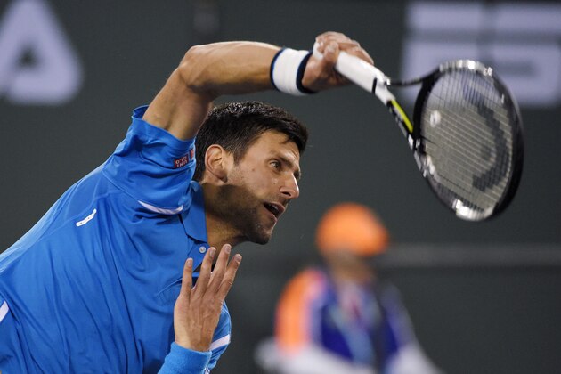Novak Djokovic, of Serbia, serves to Philipp Kohlschreiber, of Germany, at the BNP Paribas Open tennis tournament, Tuesday, March 15, 2016, in Indian Wells, Calif. (AP Photo/Mark J. Terrill)