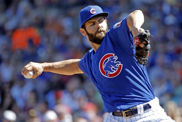 Chicago Cubs' Jake Arrieta throws during the first inning of a spring training baseball game against the Cleveland Indians Wednesday, March 9, 2016, in Mesa, Ariz. (AP Photo/Morry Gash)