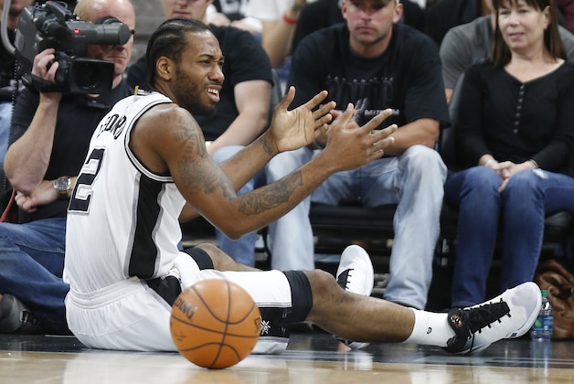 SAN ANTONIO,TX - MARCH 15: Kawhi Leonard #2 of the San Antonio Spurs reacts after being fouled by Los Angeles Clippers at AT&T Center on March 15, 2016 in San Antonio, Texas.  NOTE TO USER: User expressly acknowledges and agrees that , by downloading and or using this photograph, User is consenting to the terms and conditions of the Getty Images License Agreement. (Photo by Ronald Cortes/Getty Images)