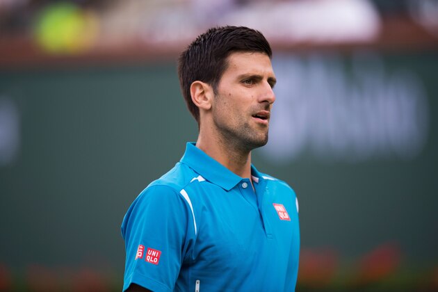 World number one Novak Djokovic of Serbia reacts after a point against Bjorn Fratangelo of USA at the BNP Paribas Open at the Indian Wells Tennis Garden on March 13, 2016, in Indian Wells, California. / AFP / ROBYN BECK        (Photo credit should read ROBYN BECK/AFP/Getty Images)