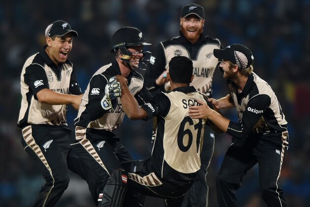 New Zealand's bowler Ish Sodhi (C) celebrates with teammates after taking the wicket of India's batsman Ravindra Jadeja during the World T20 cricket tournament match between India and New Zealand at The Vidarbha Cricket Association Stadium in Nagpur on March 15, 2016. / AFP / PUNIT PARANJPE        (Photo credit should read PUNIT PARANJPE/AFP/Getty Images)